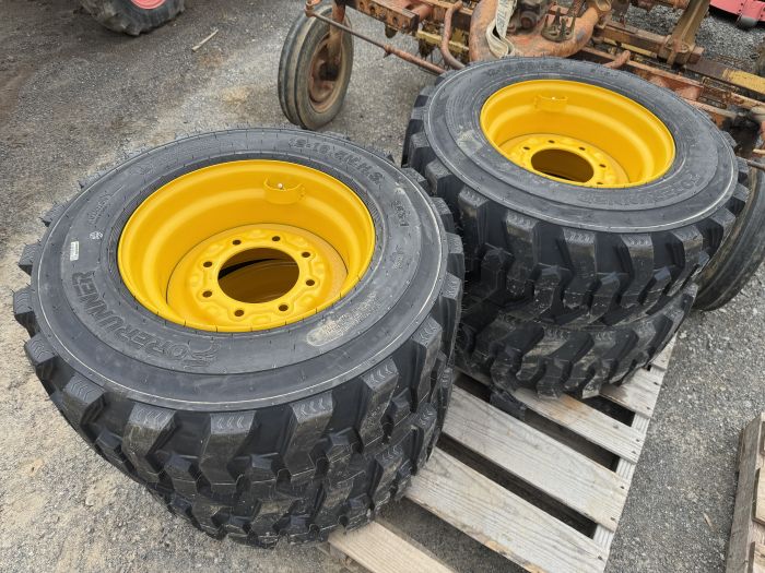 4 new 12-16.5 skid loader tires on rims