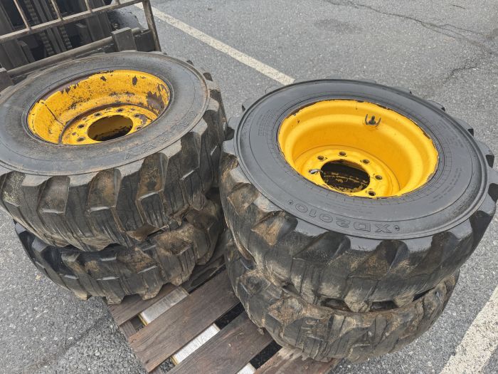 Set of 4 used 12x16.5 new holland skid loader tires and wheels