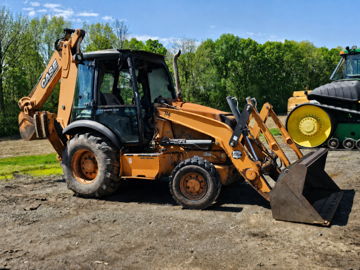 Case 580SN backhoe loader fire damage