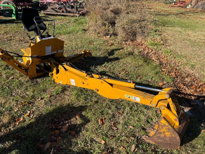 Yellow 3pt backhoe with pump